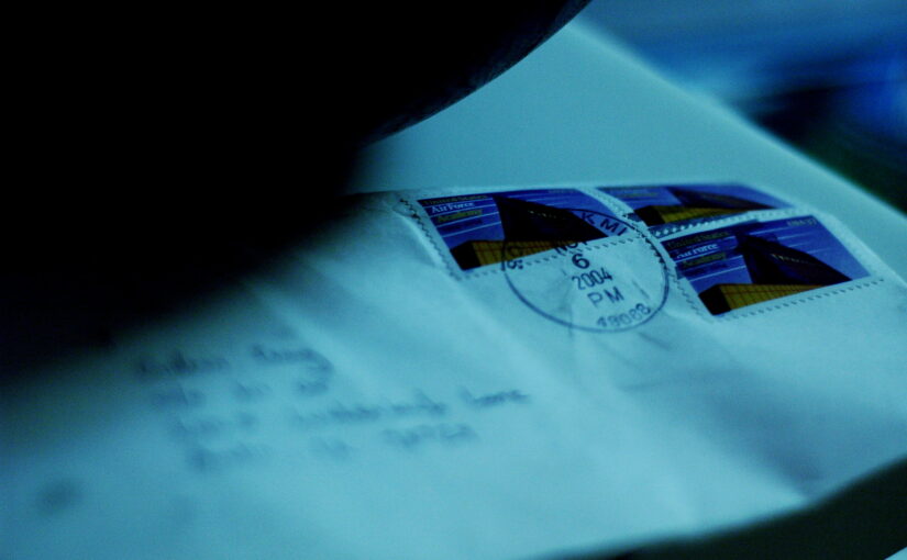Photo of a sealed envelope with a blurred out address